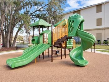 Children's play area with safety surface